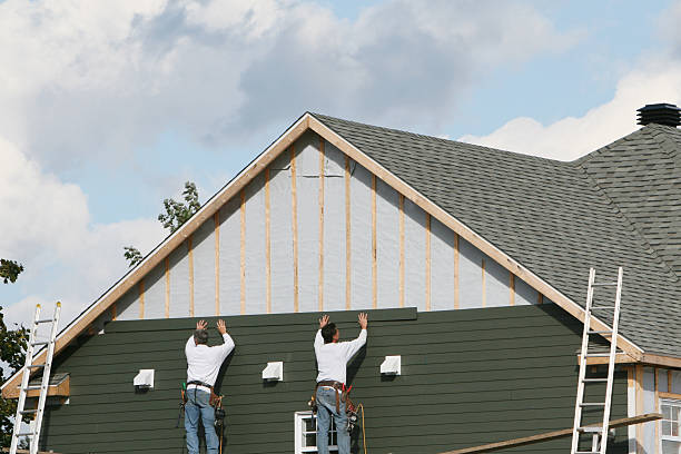 Professional Siding Contractor technician working in Pikesville, MD